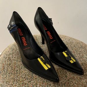 Black Miu Miu heels with zipper detail. Size 35.5